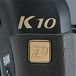 The gold K10D logo